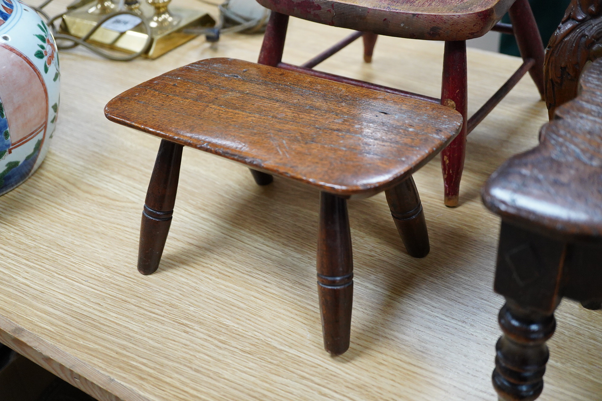 Two antique wooden stools and two children's chairs, one with arms and an upholstered seat x 51cm high